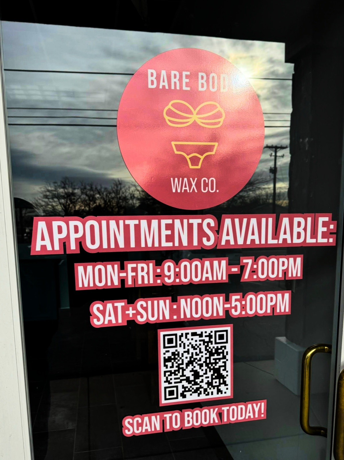 Colorful storefront window graphics for Bare Body Wax Co.
